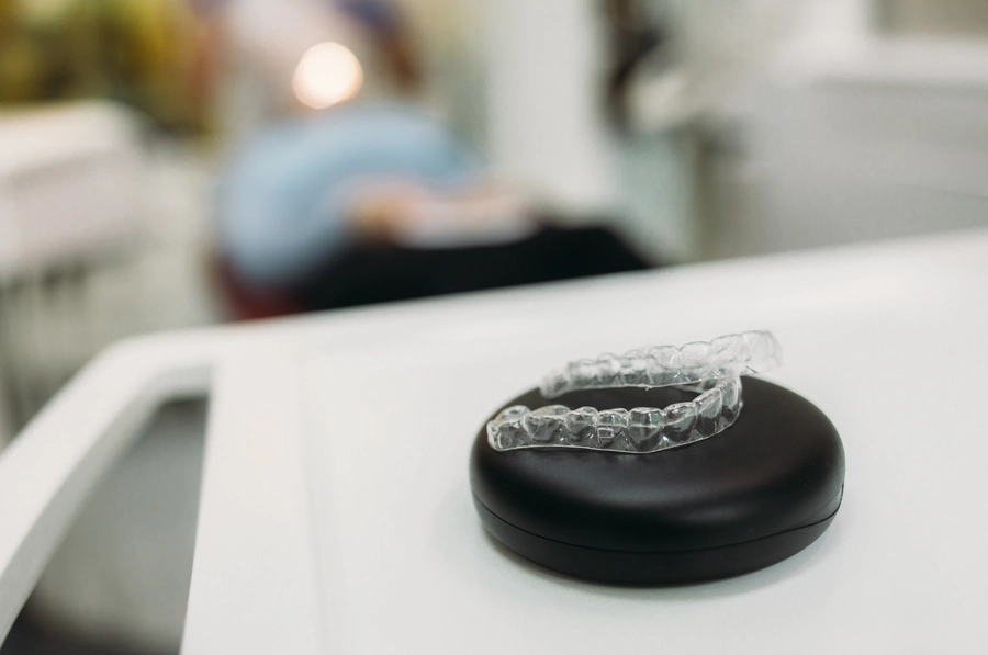 Clear Invisalign aligners in Orthodontist office
