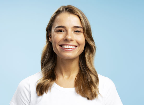Woman with white teeth after receiving teeth whitening treatment at Aspen Orthodontics Chandler, Maricopa and Queen Creek